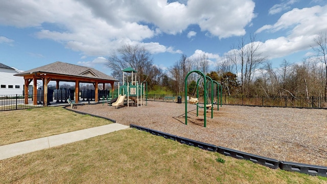 community playground with a gazebo, a yard, and fence