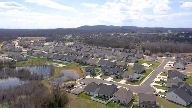 birds eye view of property featuring a residential view and a water and mountain view