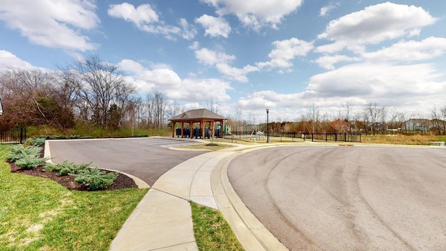 view of road with sidewalks and curbs