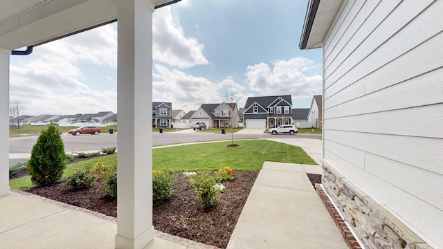 view of yard featuring a residential view