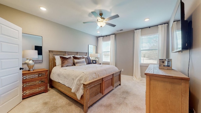 bedroom featuring recessed lighting, visible vents, light colored carpet, and ceiling fan