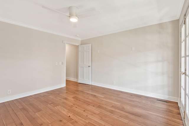 unfurnished room featuring visible vents, crown molding, baseboards, light wood-type flooring, and a ceiling fan