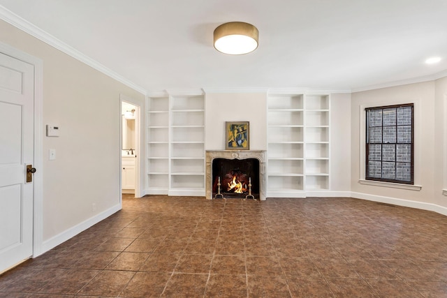 unfurnished living room with baseboards, built in shelves, a fireplace, and crown molding