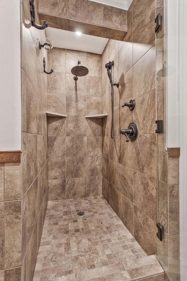 full bath with a tile shower