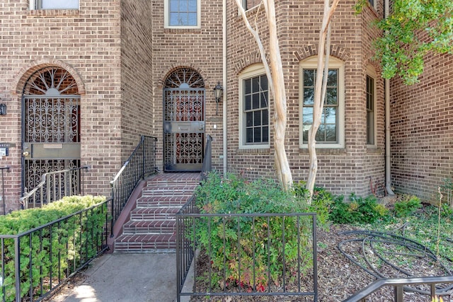 entrance to property with brick siding