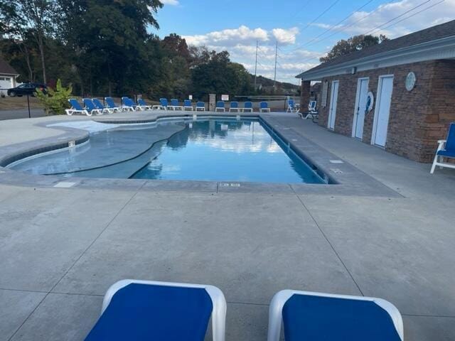 pool with a patio area