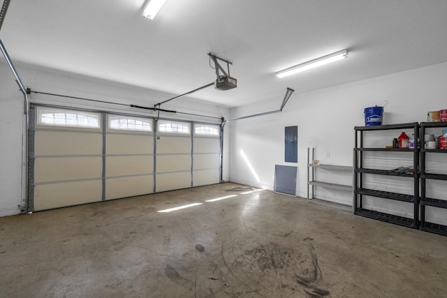 garage featuring electric panel and a garage door opener