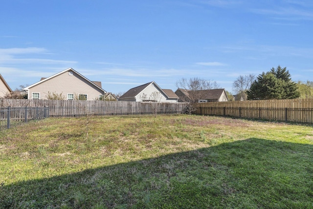 view of yard with a fenced backyard