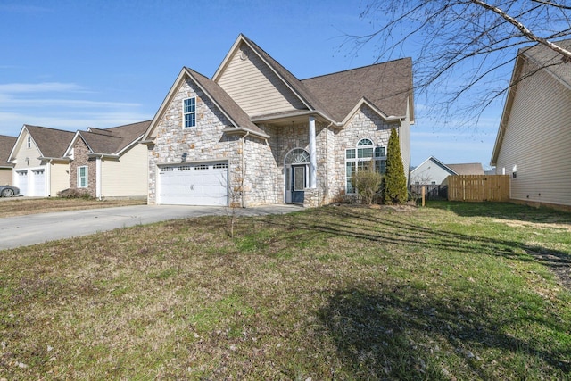 view of front of property featuring a front lawn, fence, concrete driveway, roof with shingles, and stone siding