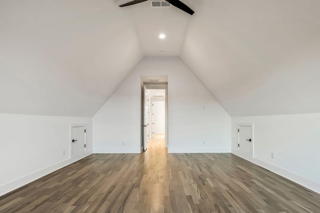 bonus room with baseboards, wood finished floors, a ceiling fan, and vaulted ceiling