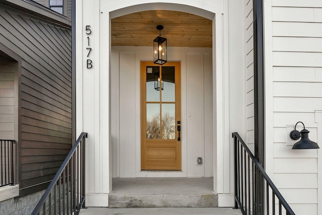 view of exterior entry featuring board and batten siding