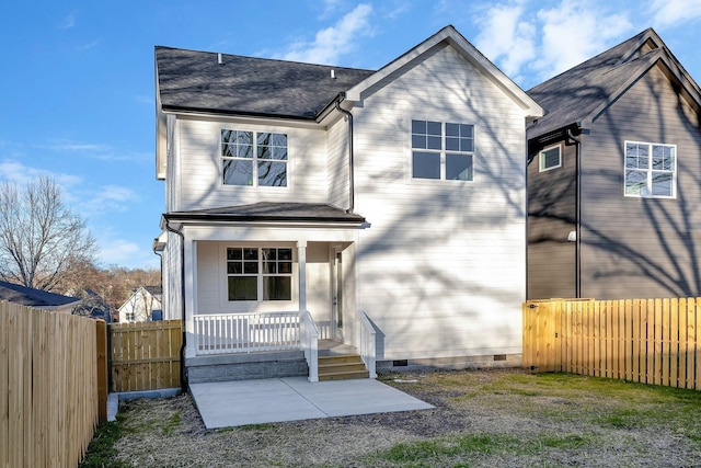 back of property featuring crawl space, roof with shingles, a porch, and a fenced backyard