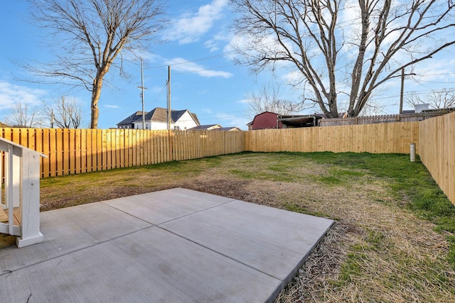 view of yard featuring a patio area and a fenced backyard