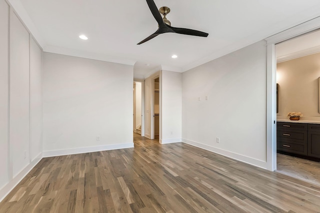 unfurnished bedroom with recessed lighting, baseboards, light wood-style floors, and ornamental molding