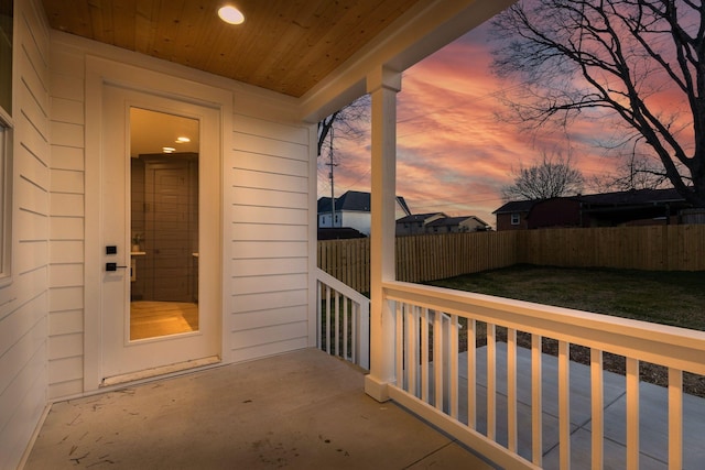 view of balcony at dusk