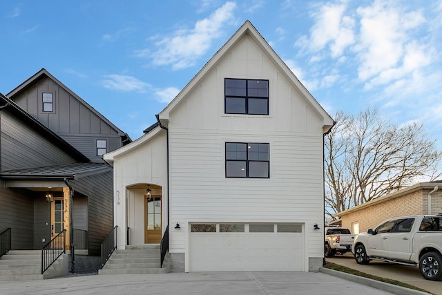 view of front of house with a garage, board and batten siding, and concrete driveway