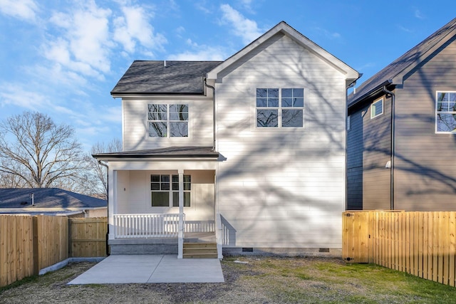 rear view of house featuring crawl space, a porch, a fenced backyard, and a patio area