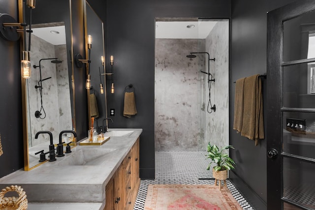 bathroom featuring double vanity, a walk in shower, and a sink