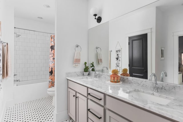 full bath featuring double vanity, shower / bathtub combination with curtain, toilet, and a sink