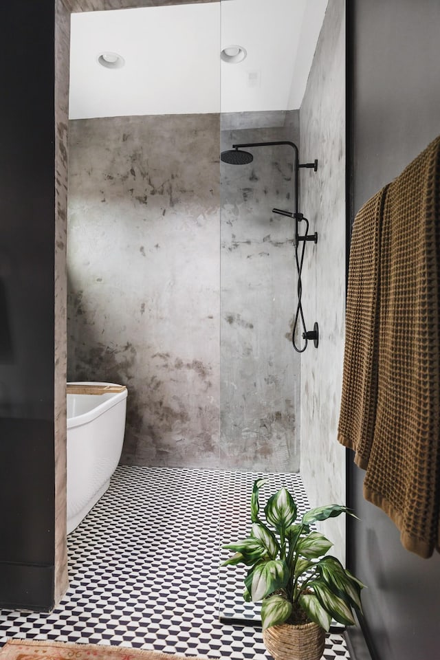 bathroom with a tile shower