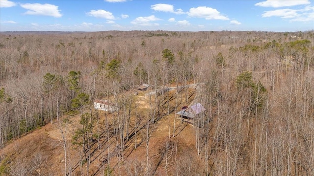 drone / aerial view featuring a forest view