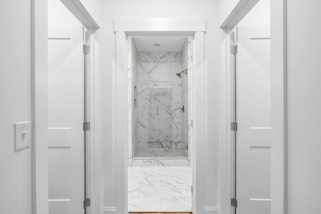 bathroom with a marble finish shower