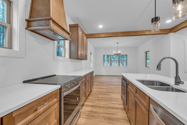 kitchen featuring premium range hood, stainless steel appliances, brown cabinetry, and a sink