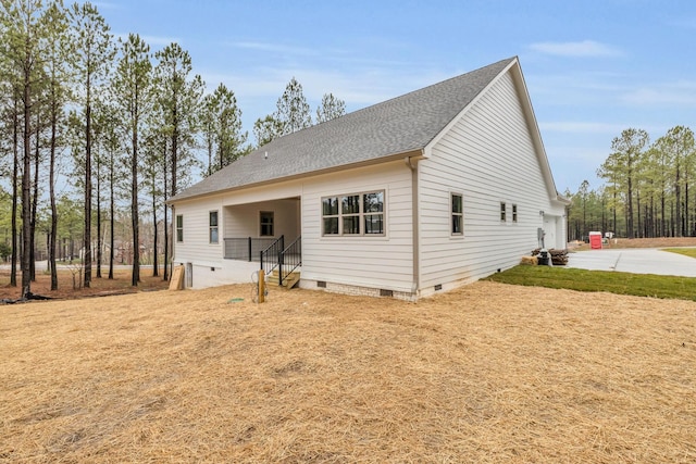 view of front facade with crawl space, driveway, and a shingled roof