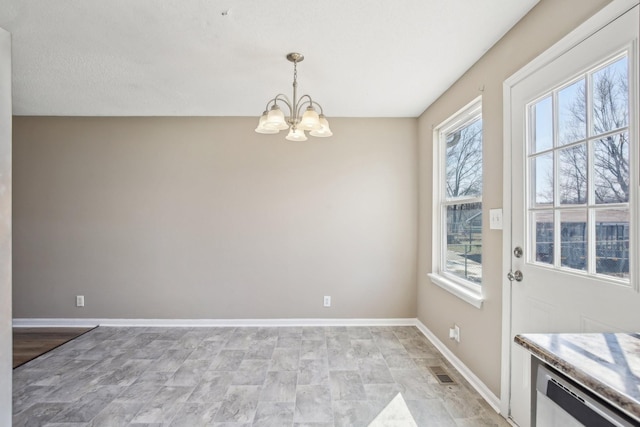 dining room featuring visible vents, baseboards, and an inviting chandelier