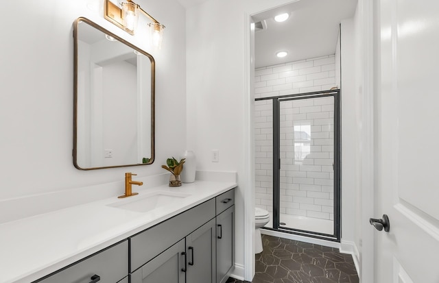 bathroom featuring tile patterned floors, toilet, a stall shower, recessed lighting, and vanity