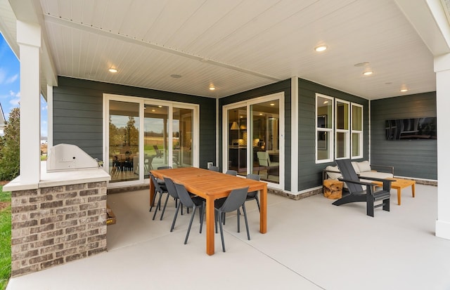 view of patio / terrace featuring area for grilling and outdoor dining space