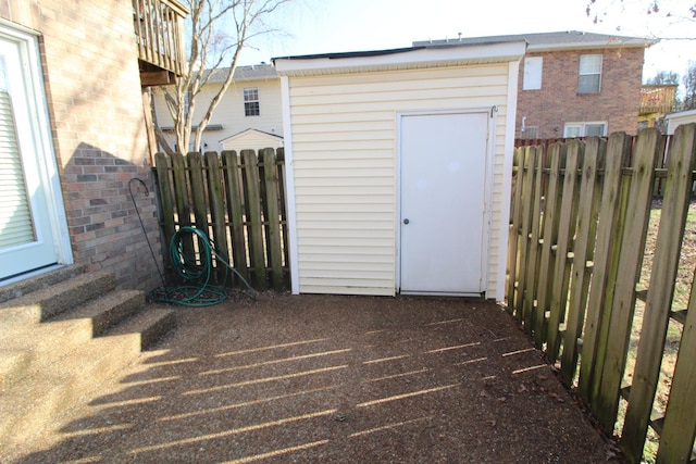 view of shed with a fenced backyard