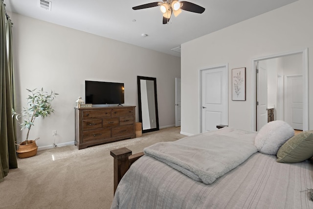 bedroom with light carpet, visible vents, ceiling fan, and baseboards