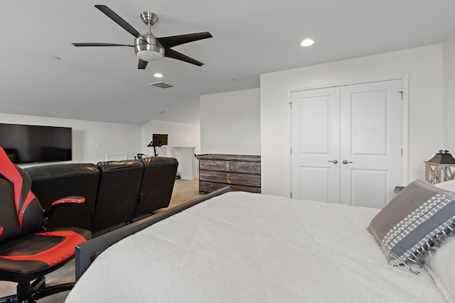 bedroom with carpet, visible vents, lofted ceiling, recessed lighting, and a closet