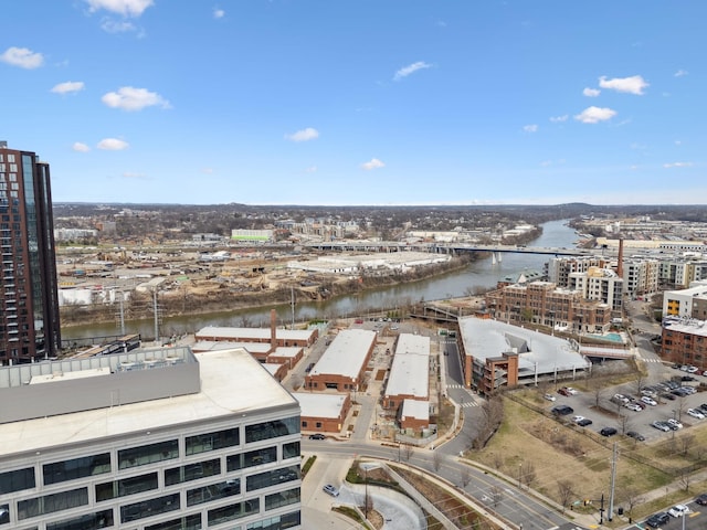 drone / aerial view featuring a view of city and a water view