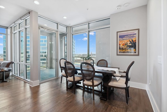 dining area featuring dark wood-style floors, recessed lighting, baseboards, and expansive windows