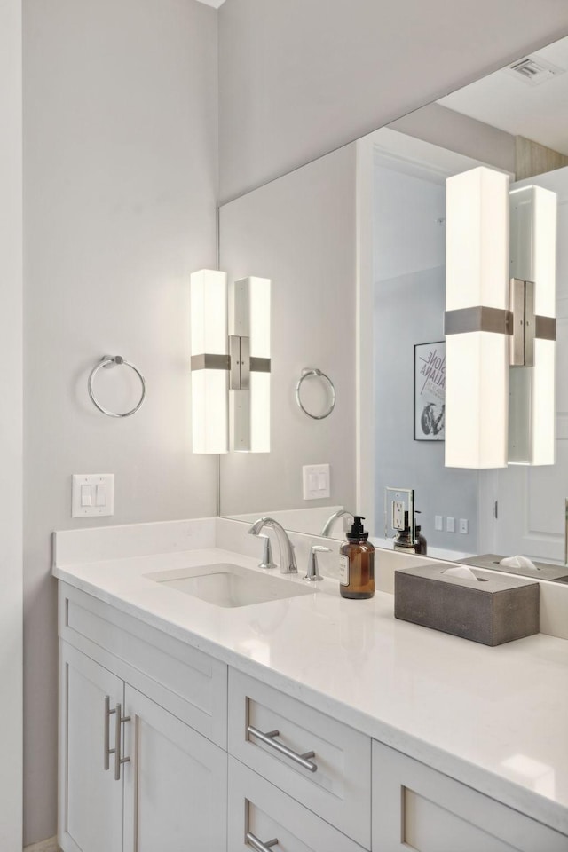 bathroom with visible vents and vanity