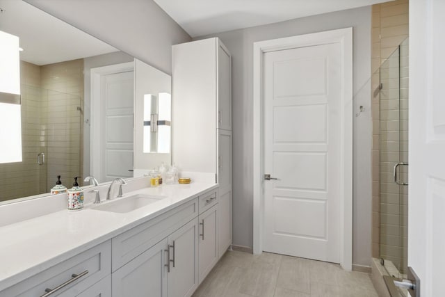 full bath with a stall shower and vanity