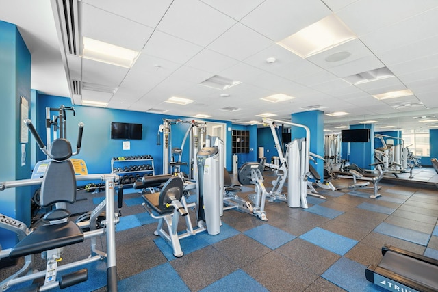 gym featuring a paneled ceiling