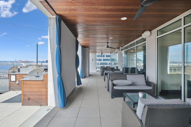 view of patio featuring a balcony, a ceiling fan, area for grilling, grilling area, and outdoor lounge area