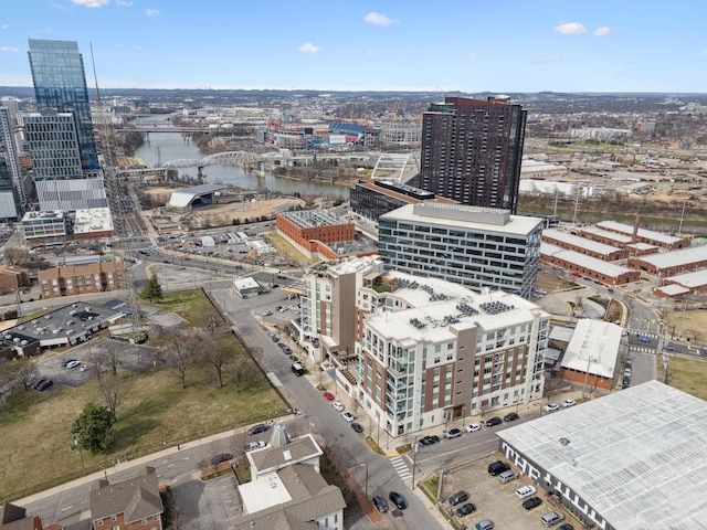 drone / aerial view with a city view and a water view