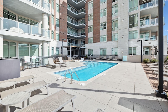 view of swimming pool featuring a patio area