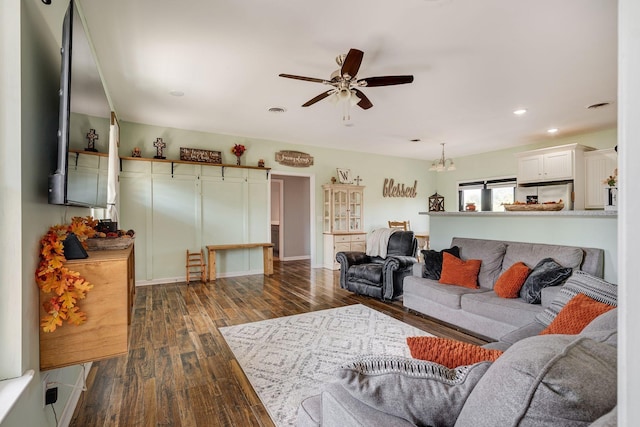 living area featuring visible vents, recessed lighting, ceiling fan, and dark wood-style flooring