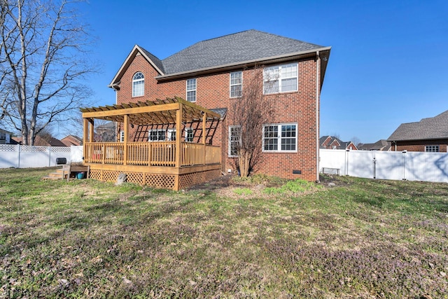 back of property featuring a wooden deck, a yard, a fenced backyard, and a pergola