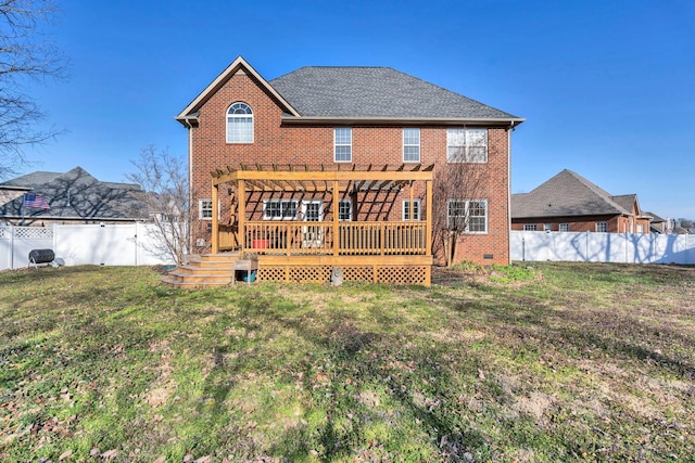 rear view of property featuring a deck, a pergola, a fenced backyard, a yard, and brick siding