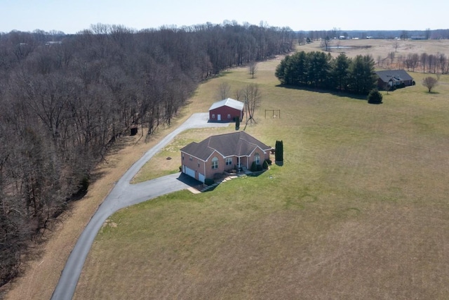 bird's eye view with a rural view and a wooded view