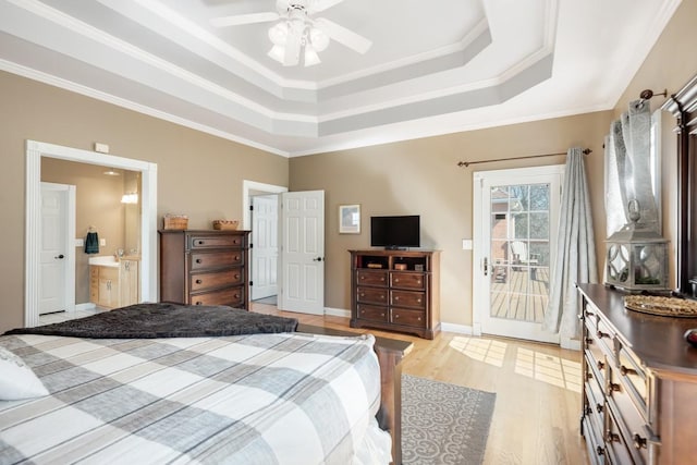 bedroom with a tray ceiling, light wood-style flooring, access to exterior, and ornamental molding