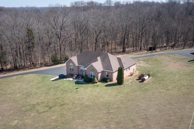 aerial view featuring a wooded view