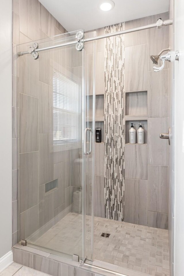 bathroom with a stall shower