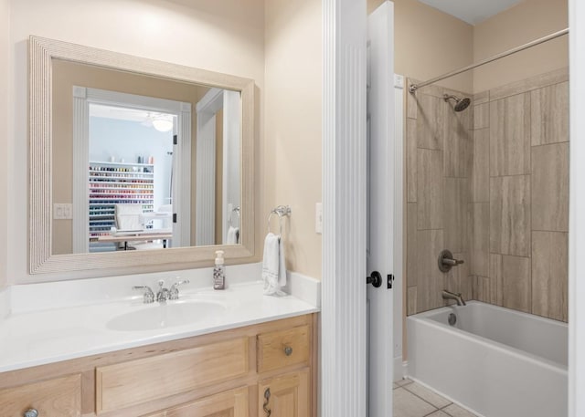 bathroom with tile patterned floors, bathtub / shower combination, and vanity